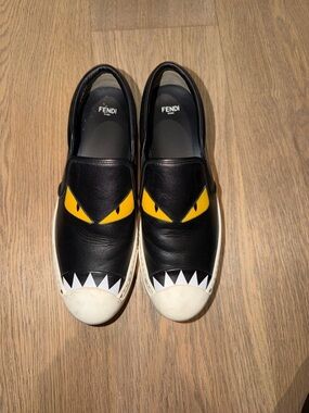 Fendi Black Leather Slip-On Sneakers with Yellow Eye and White Tooth Detail
